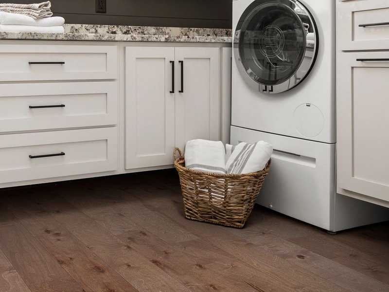 laundry room with hardwood floors