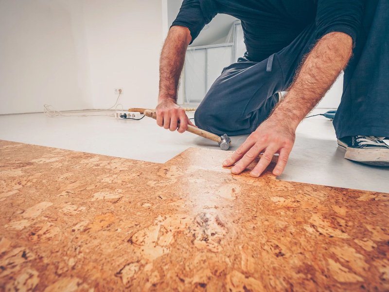 person installing cork floor